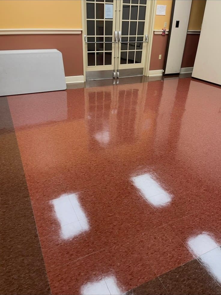 The same hall floor after, wet-look finish, Flemington. Patriotic Office Cleaning.